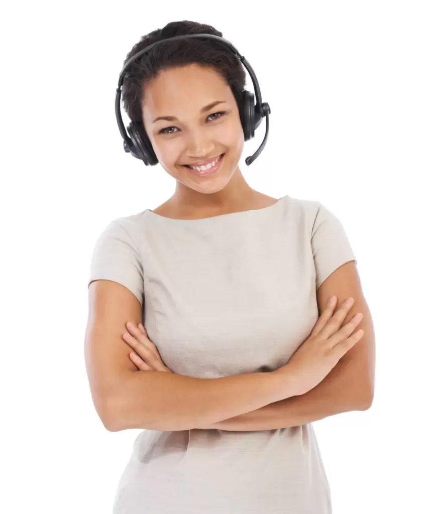 Studio portrait of an attractive young woman talking on a headset isolated on white